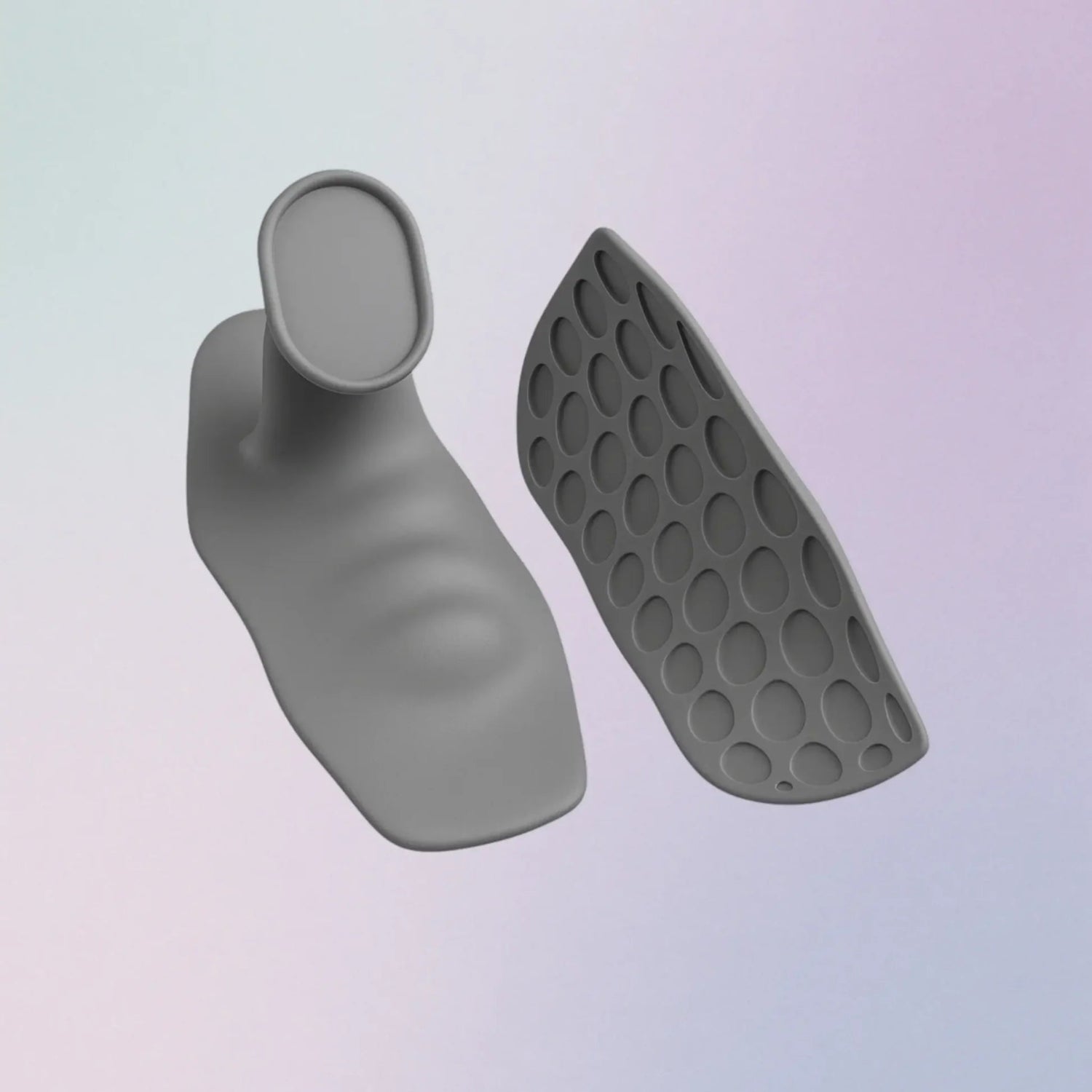 Gray silicone foot-shaped product with textured sole on a light gradient background